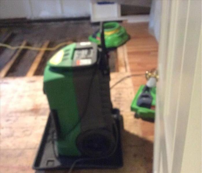 SERVPRO drying equipment in an attic with missing floorboards