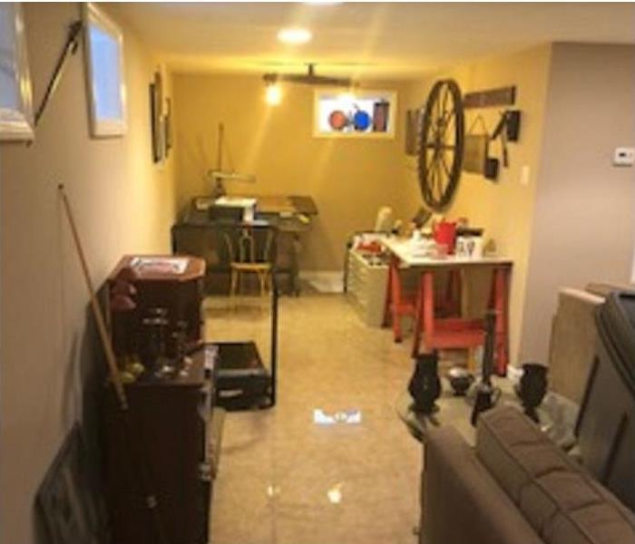 standing water in basement apartment, impacting furniture