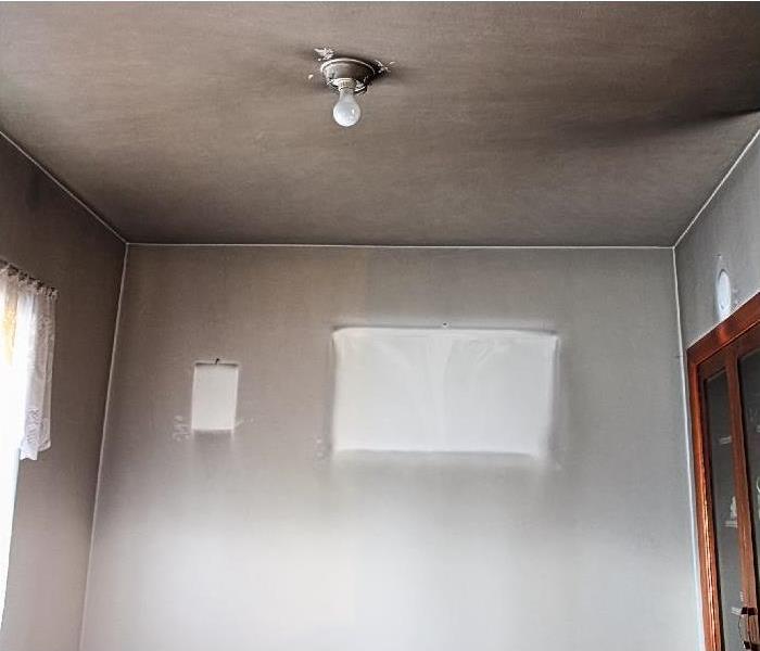 smoke and soot damage on walls and ceiling